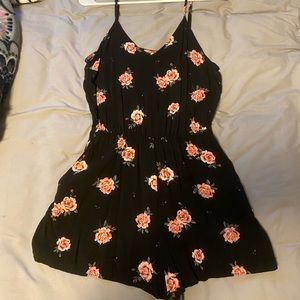 H&M floral romper, size medium, with pockets.